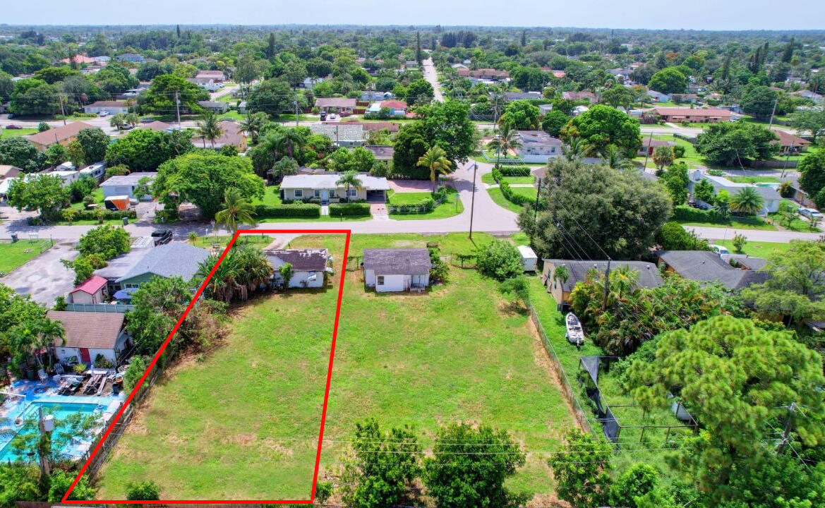 1280 Sunset Road West Palm Beach, FL 33406 - Photo 1 of 5 an aerial view of a houses with a yard