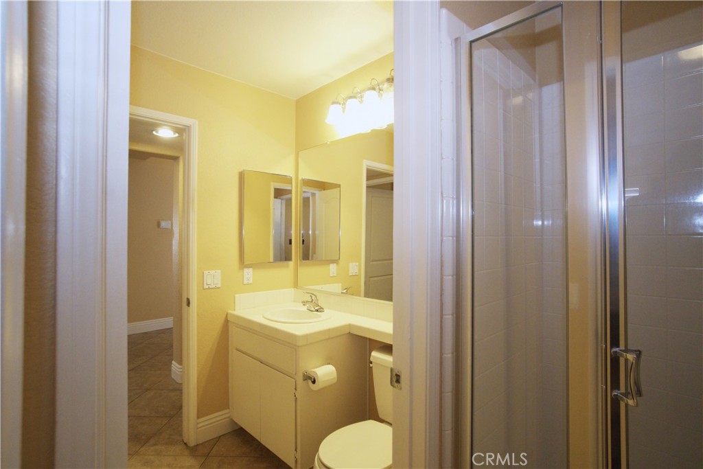 7135 Highland Spring Lane Highland, CA 92346 - Photo 28 of 72 Guest bathroom on the main level has a door to separate the shower area