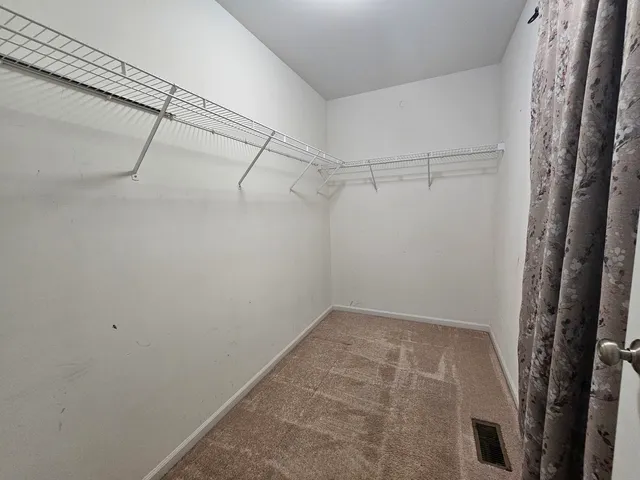 a view of a room with racks on the wall