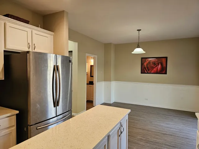 a kitchen with stainless steel appliances a refrigerator and a stove