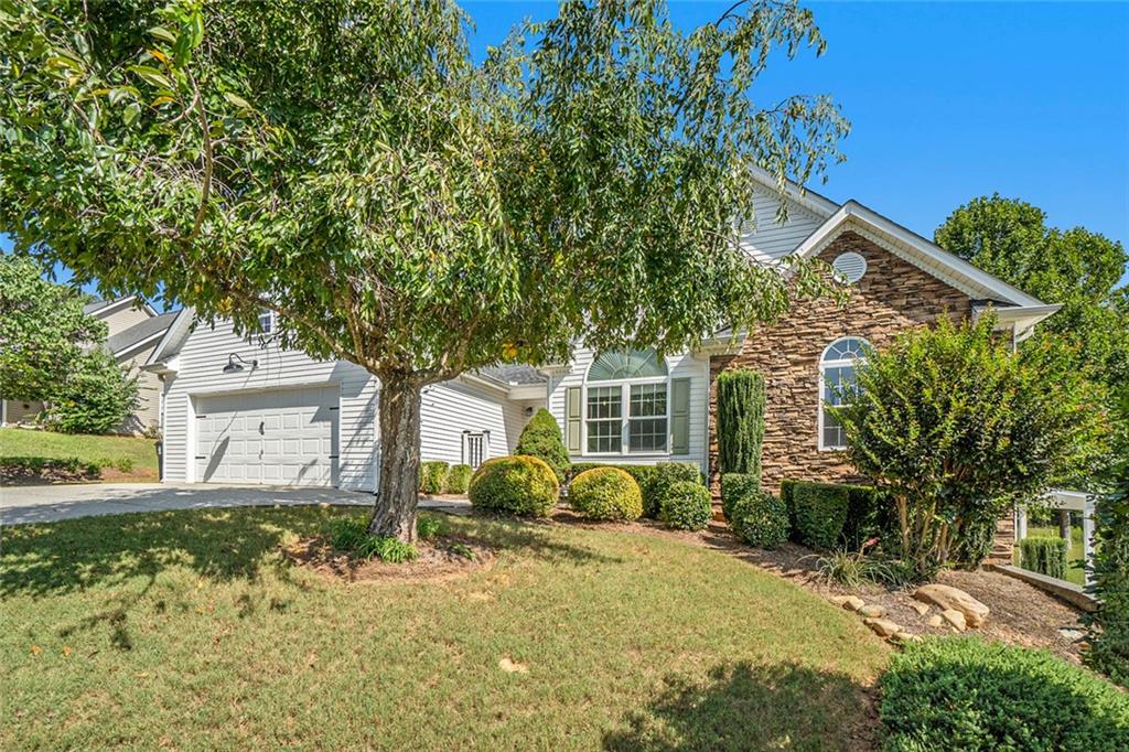 119 Foxdale Way Dallas, GA 30132 - Photo 1 of 1 a front view of a house with garden