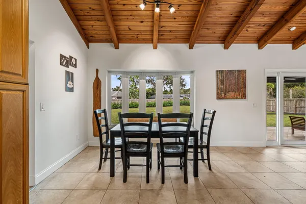 a dining room with furniture and window