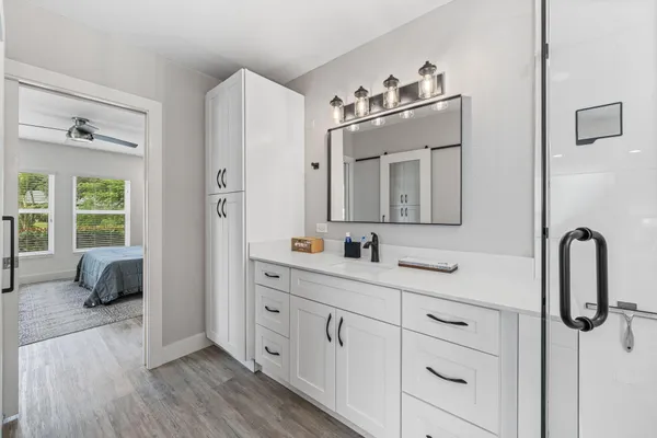 a bathroom with a double vanity sink double vanity and mirror