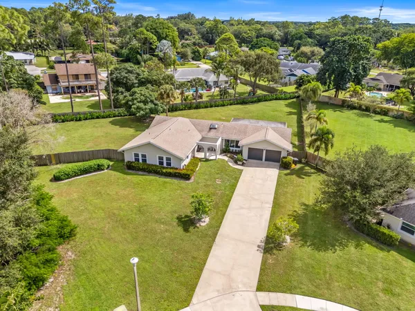 an aerial view of a house with a garden