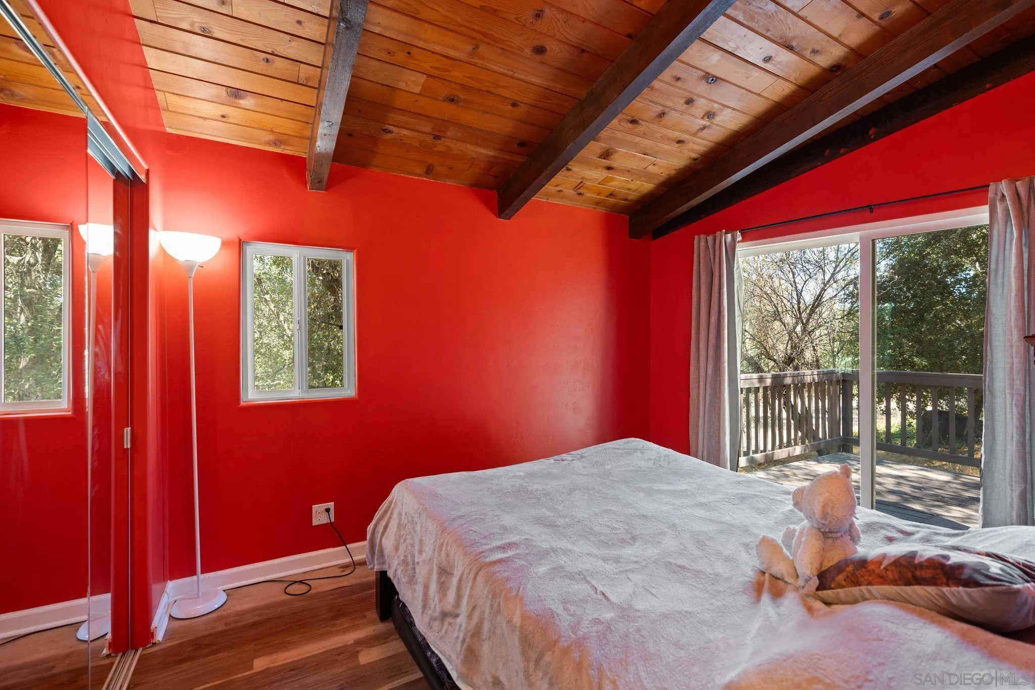 4722 Park Lane Alpine, CA 91901 - Photo 13 of 35 a bedroom with a bed and wooden floor