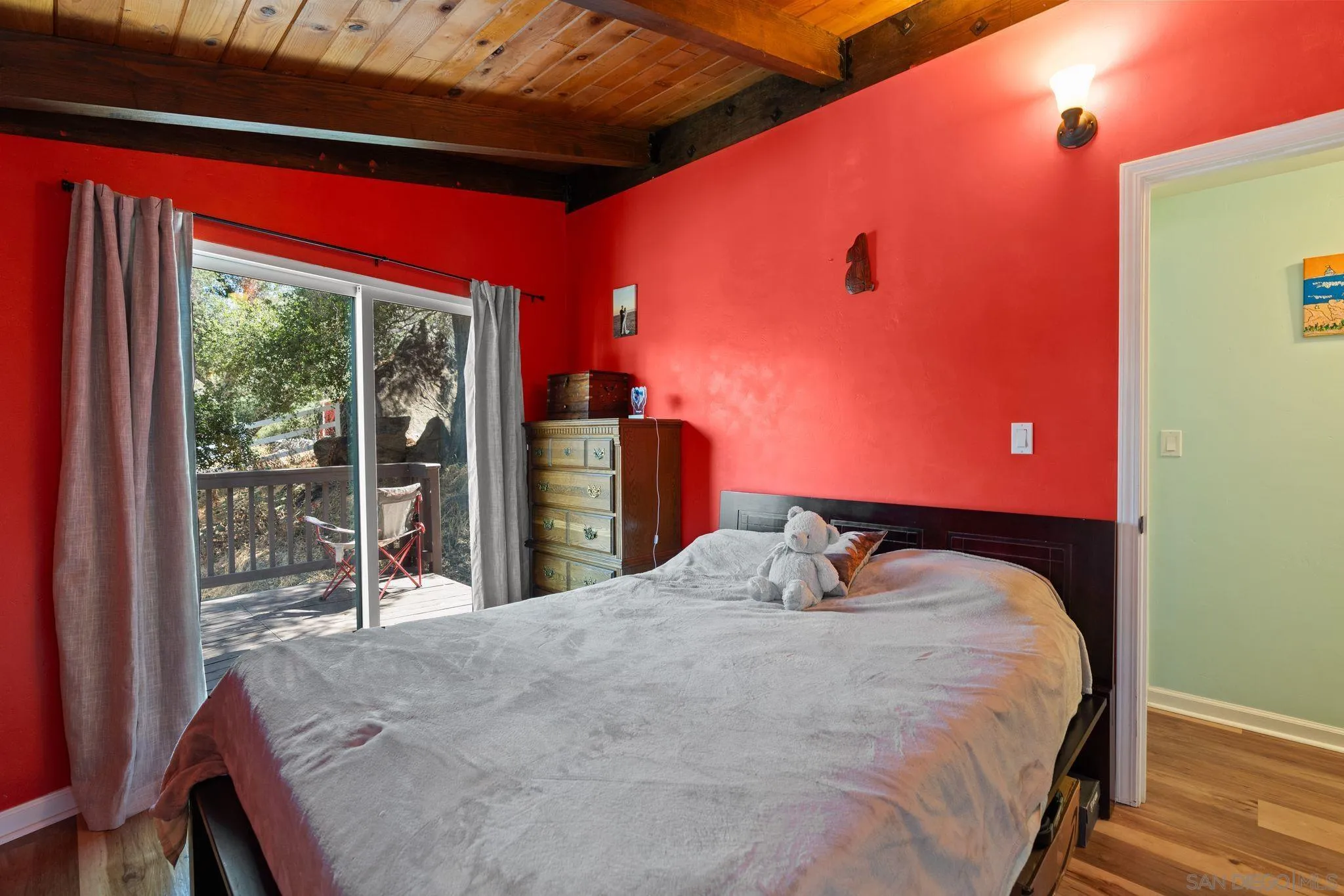 4722 Park Lane Alpine, CA 91901 - Photo 14 of 35 a bedroom with a bed and wooden floor