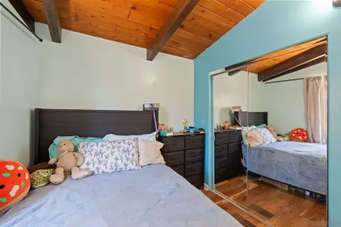 a bedroom with furniture and a window