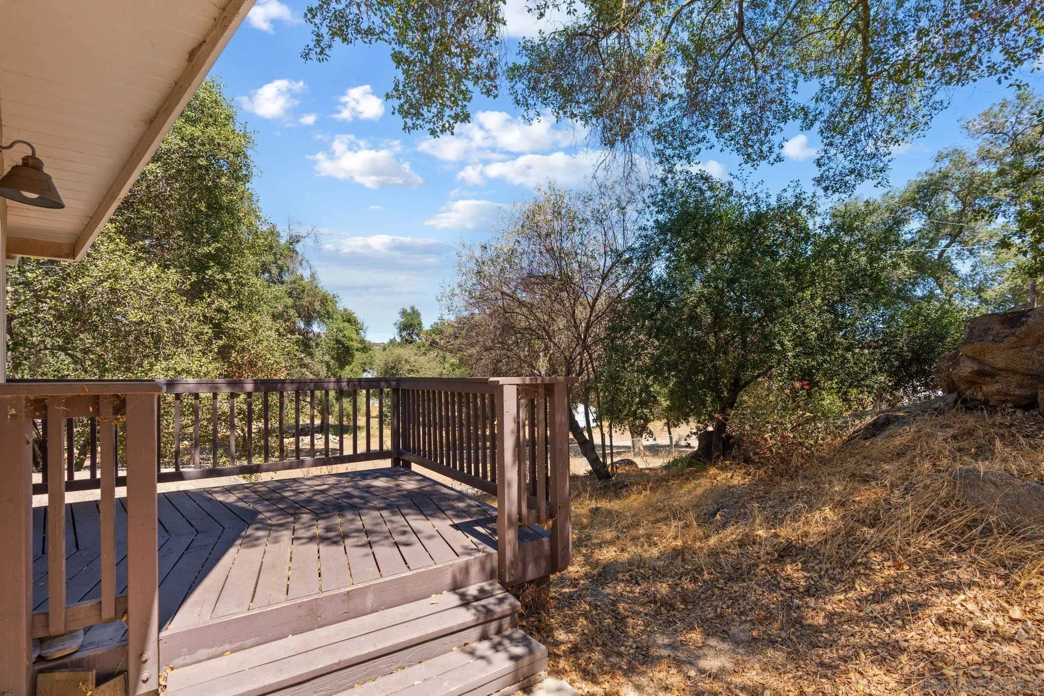 4722 Park Lane Alpine, CA 91901 - Photo 18 of 35 a view of balcony with wooden floor and fence