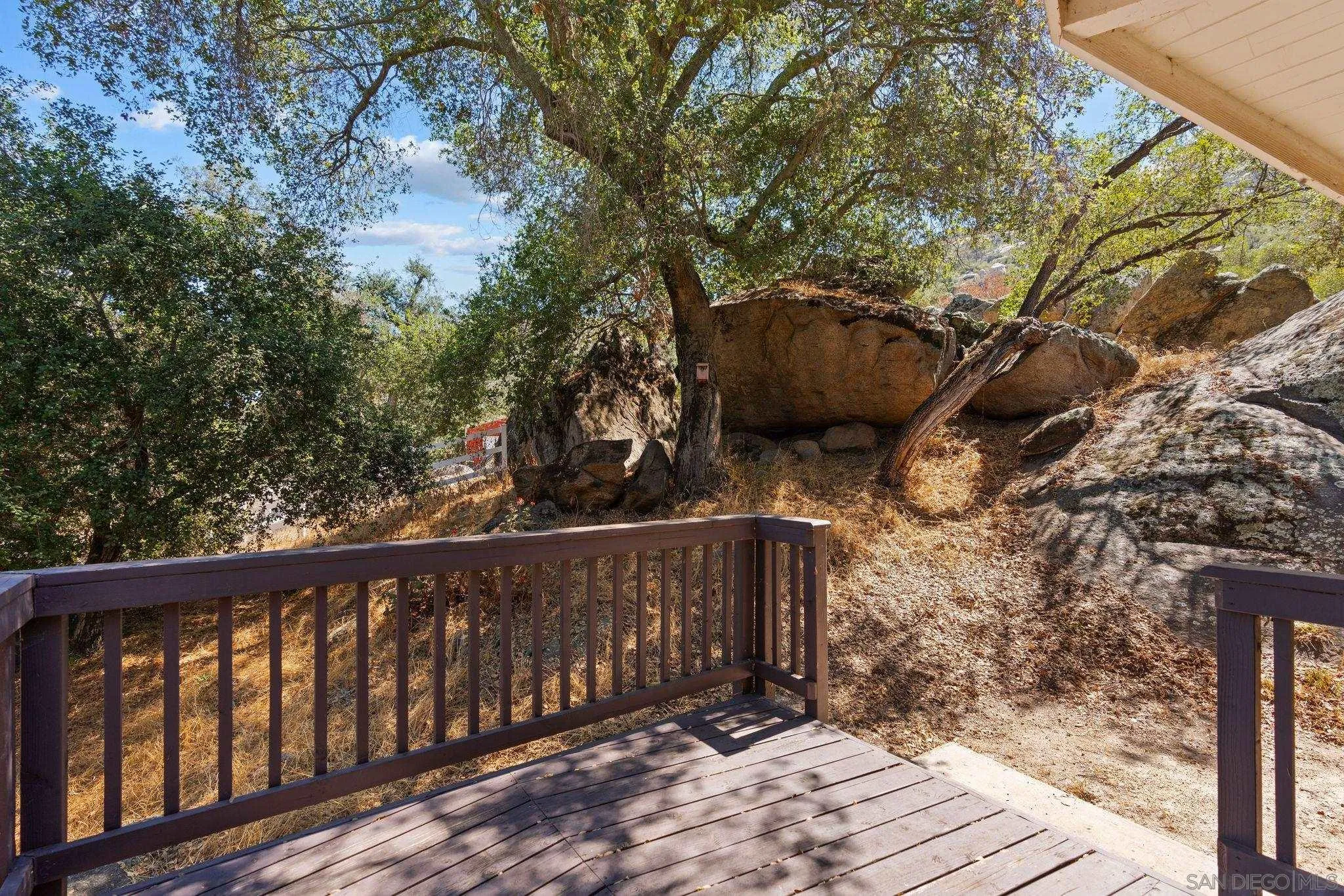 4722 Park Lane Alpine, CA 91901 - Photo 20 of 35 a wooden fence with trees in the background