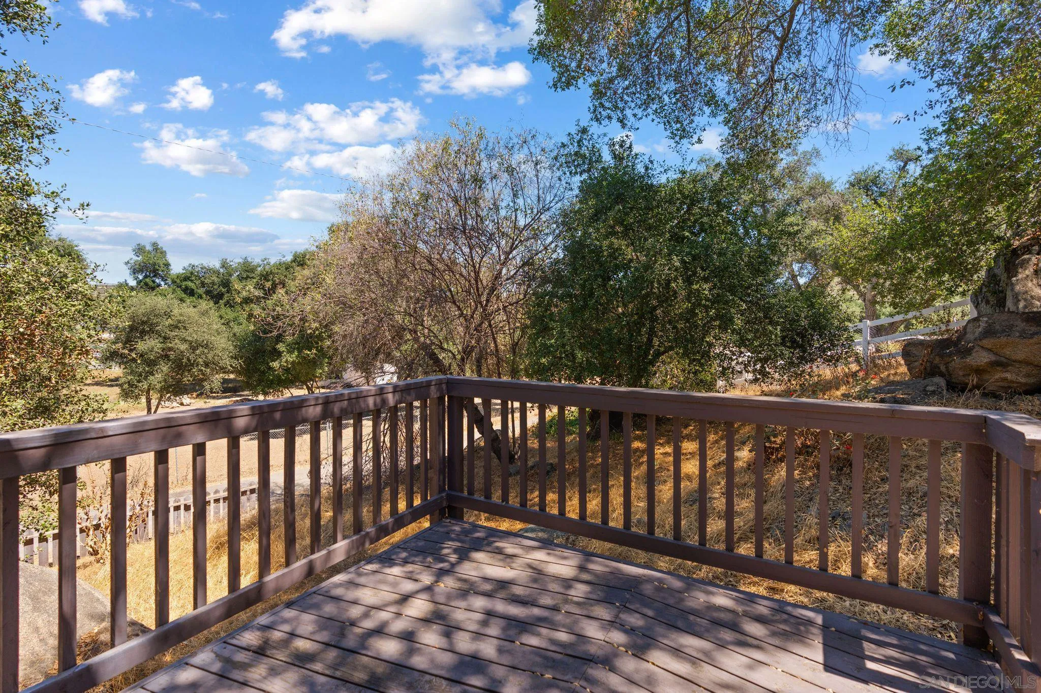 4722 Park Lane Alpine, CA 91901 - Photo 21 of 35 a balcony with wooden floor and trees