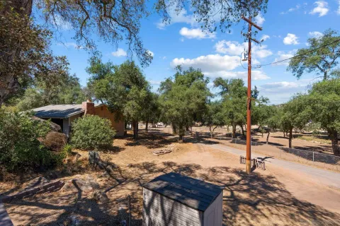 a view of a backyard of the house