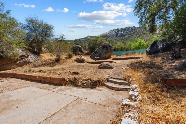 a view of a backyard of the house