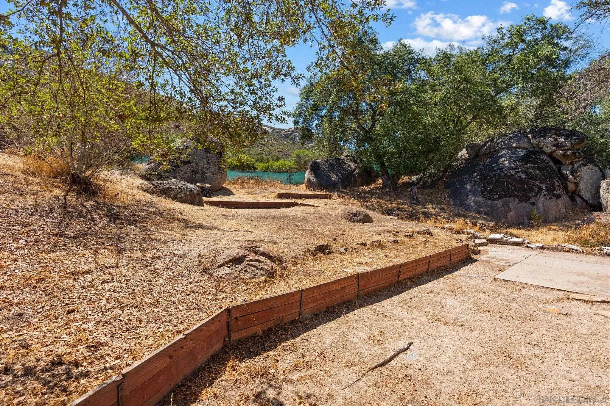 4722 Park Lane Alpine, CA 91901 - Photo 24 of 35 a view of a yard with wooden fence