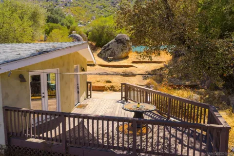 a view of a balcony with furniture