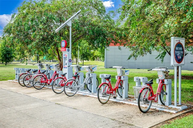 a view of bike storage next to a yard