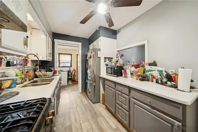 a kitchen with stove and cabinets