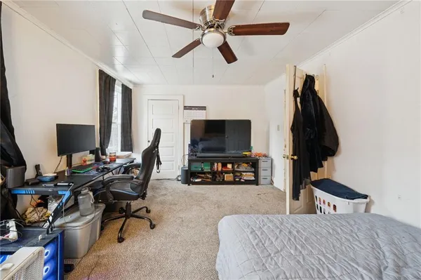 a bedroom with a workspace