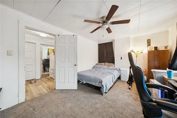 a bedroom with furniture and a window