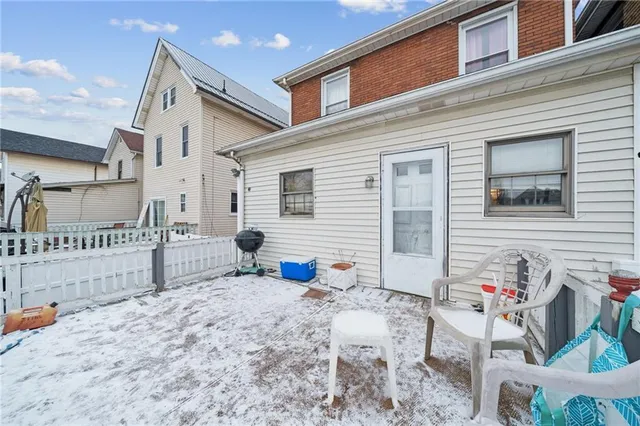 a view of a chairs and table in patio