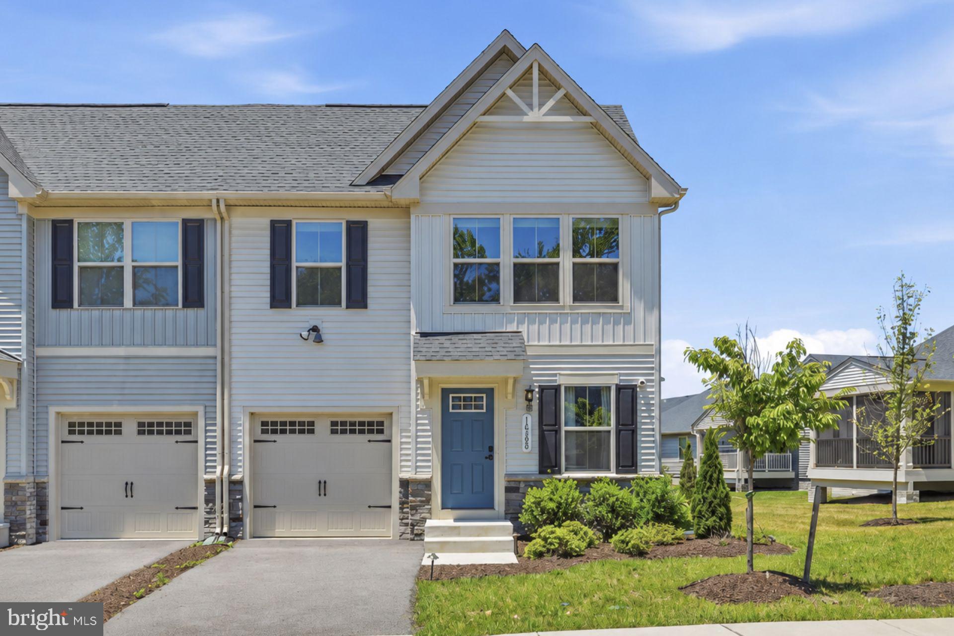14380 Longhouse Loop Brandywine, MD 20613 - Photo 20 of 20 a front view of a house with a yard and garage