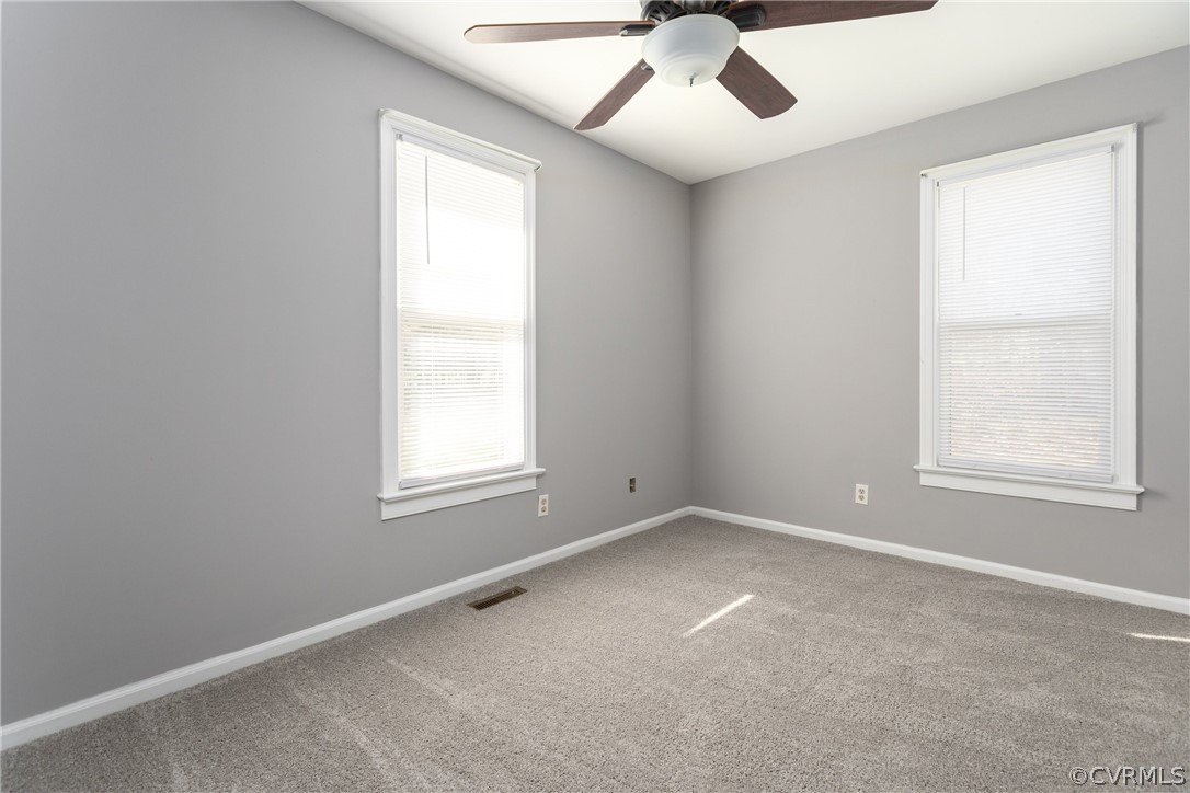 10200 Ambridge Road Chesterfield, VA 23832 - Photo 23 of 36 an empty room with a window and a fan
