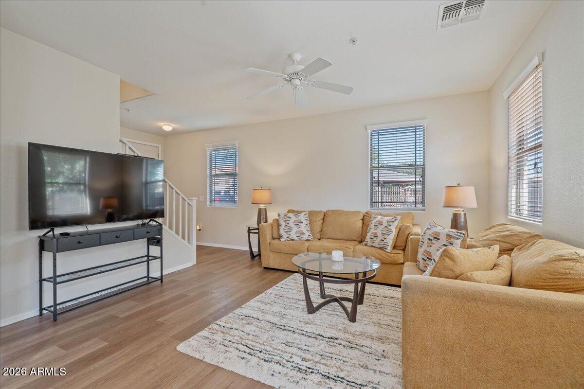 1255 South Rialto, Unit 106 Mesa, AZ 85209 - Photo 2 of 32 a living room with furniture and a flat screen tv