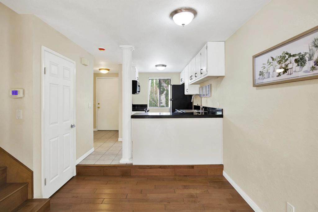 2383 Altisma Way, Unit D Carlsbad, CA 92009 - Photo 12 of 40 a view of kitchen with wooden floor
