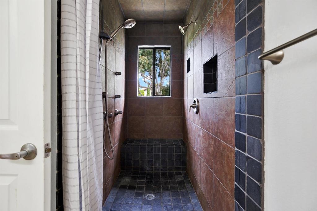 2383 Altisma Way, Unit D Carlsbad, CA 92009 - Photo 20 of 40 a bathroom with a shower
