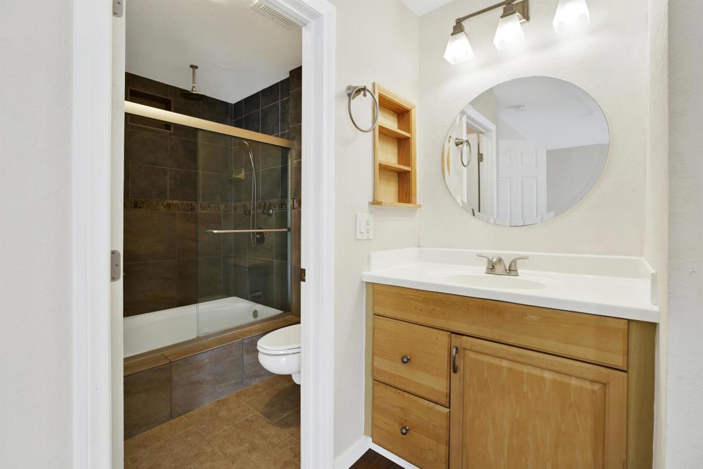 2383 Altisma Way, Unit D Carlsbad, CA 92009 - Photo 24 of 40 a bathroom with a sink a toilet and shower