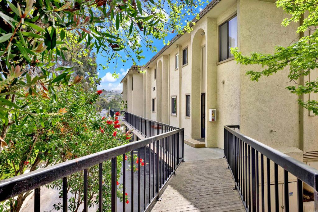 2383 Altisma Way, Unit D Carlsbad, CA 92009 - Photo 31 of 40 a view of a house with balcony and trees
