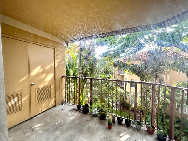 741 North Pine Island Road, Unit 303 Plantation, FL 33324 - Photo 18 of 32 a view of a balcony with plants