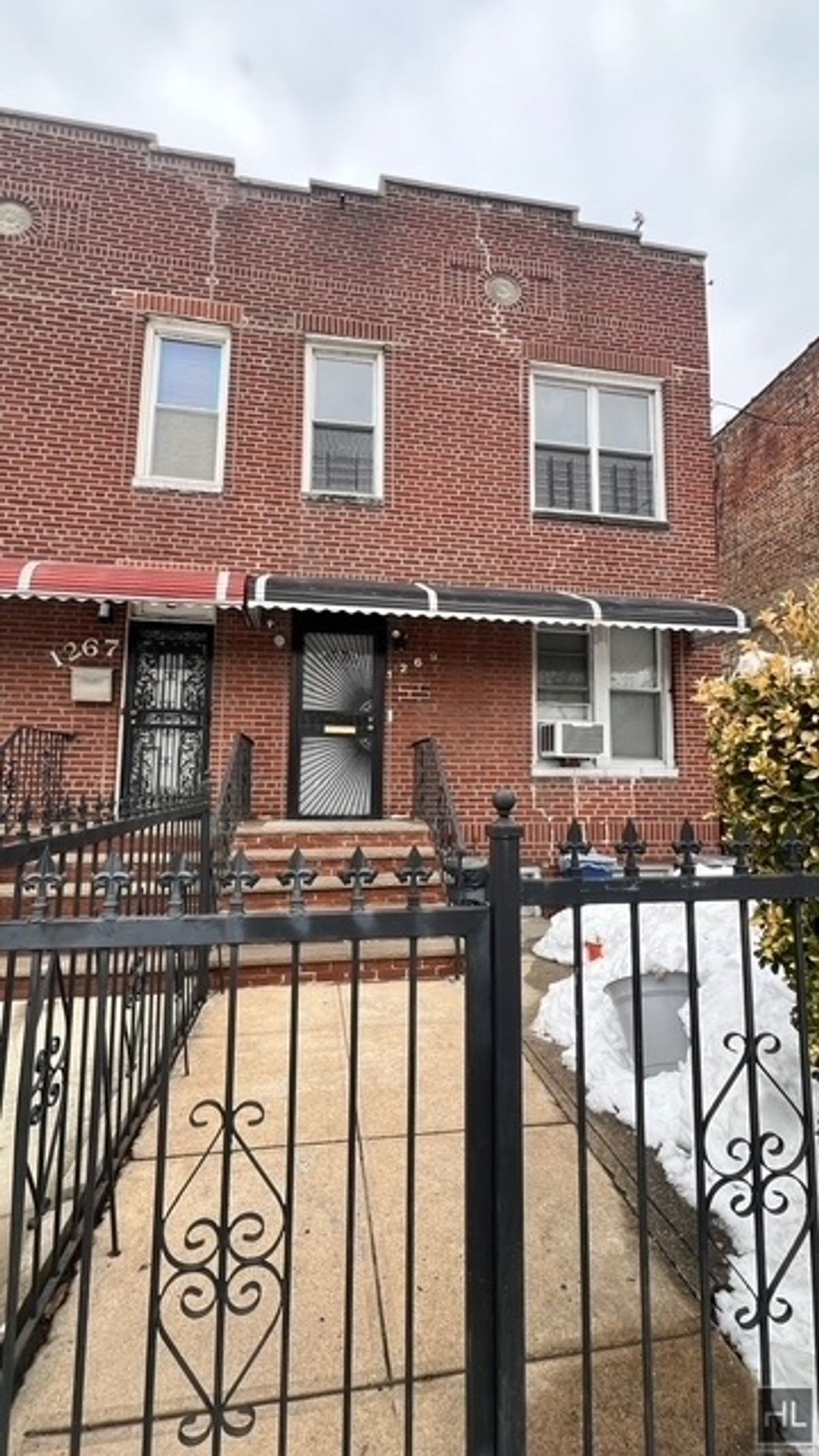 1269 Remsen Avenue, Unit 2 Brooklyn, NY 11236 - Photo 22 of 22 a view of a brick house with large windows