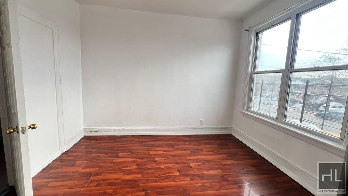 1269 Remsen Avenue, Unit 2 Brooklyn, NY 11236 - Photo 4 of 22 wooden floor in an empty room with a window