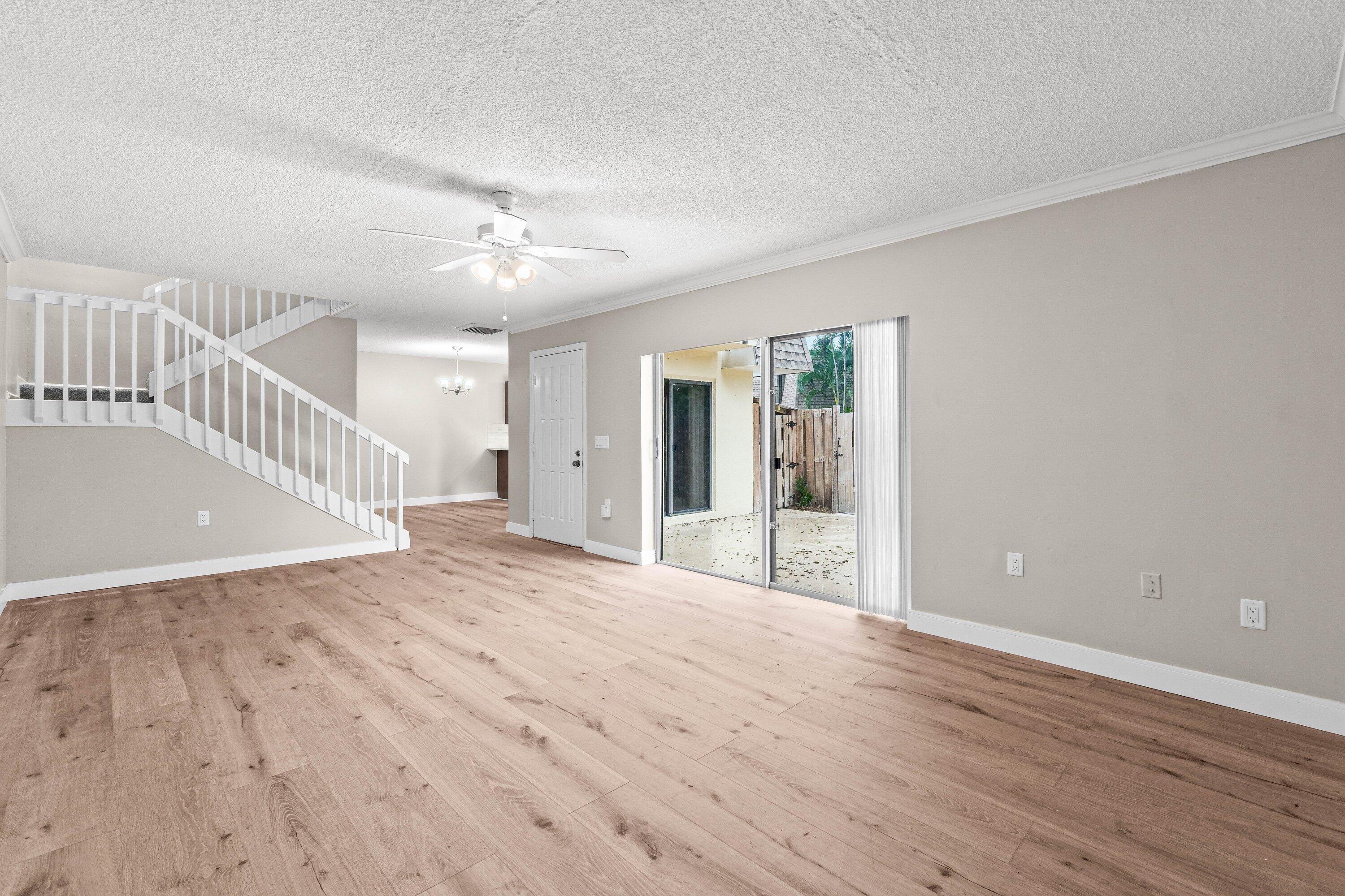 2905 Southwest 22nd Circle, Unit 40A Delray Beach, FL 33445 - Photo 11 of 38 a view of an empty room with wooden floor