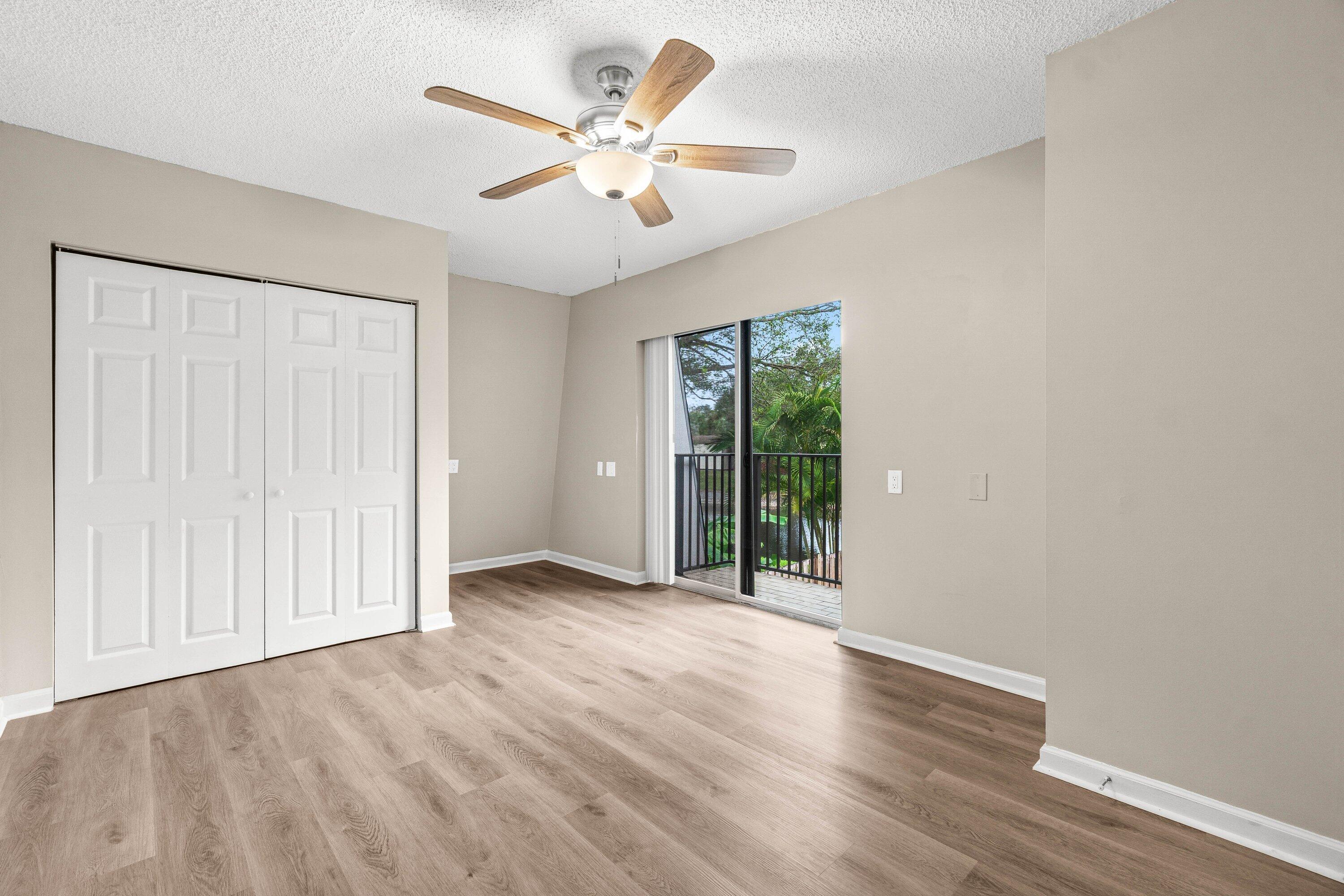 2905 Southwest 22nd Circle, Unit 40A Delray Beach, FL 33445 - Photo 21 of 38 wooden floor in an empty room with a window