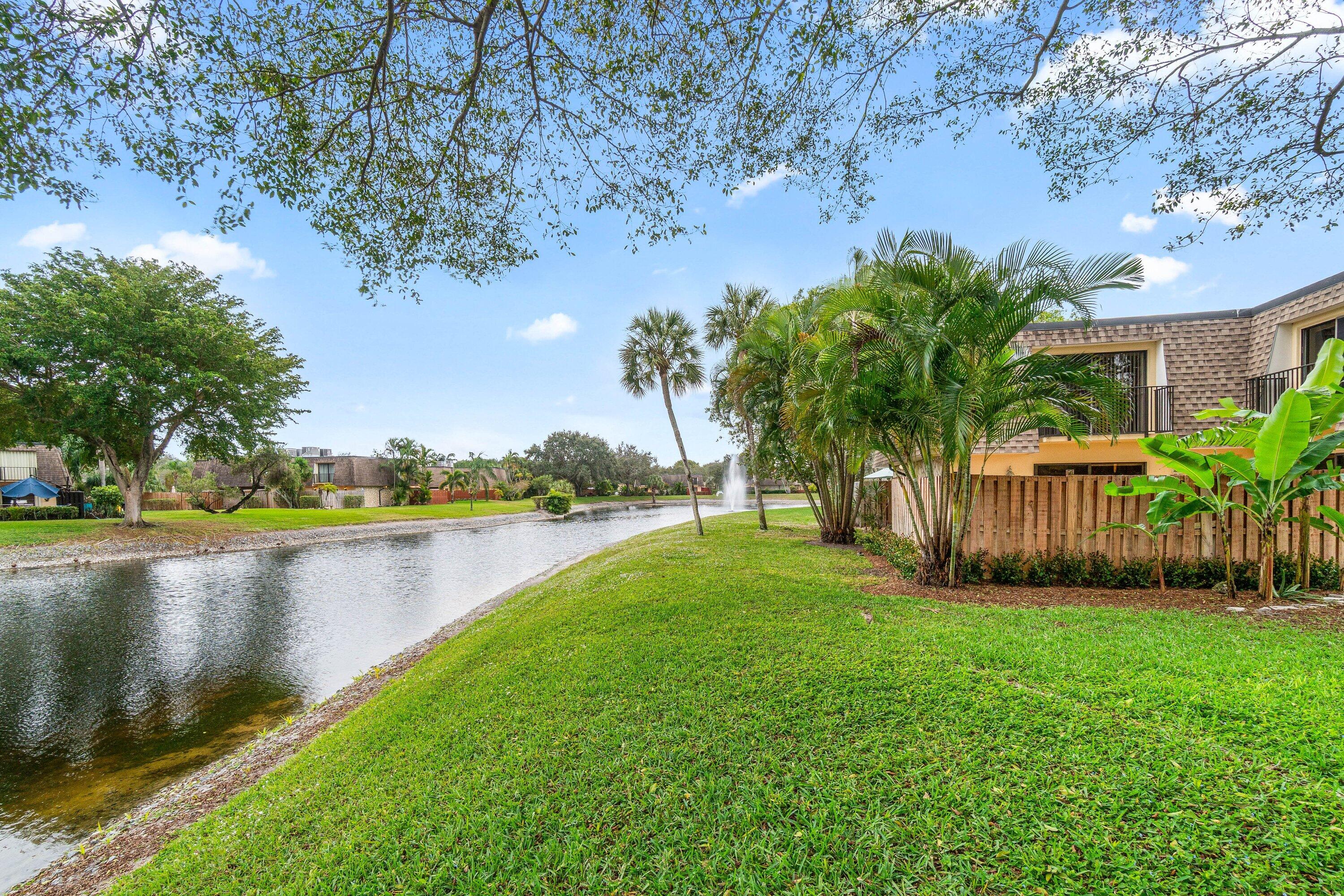 2905 Southwest 22nd Circle, Unit 40A Delray Beach, FL 33445 - Photo 29 of 38 a view of a house with swimming pool and a yard