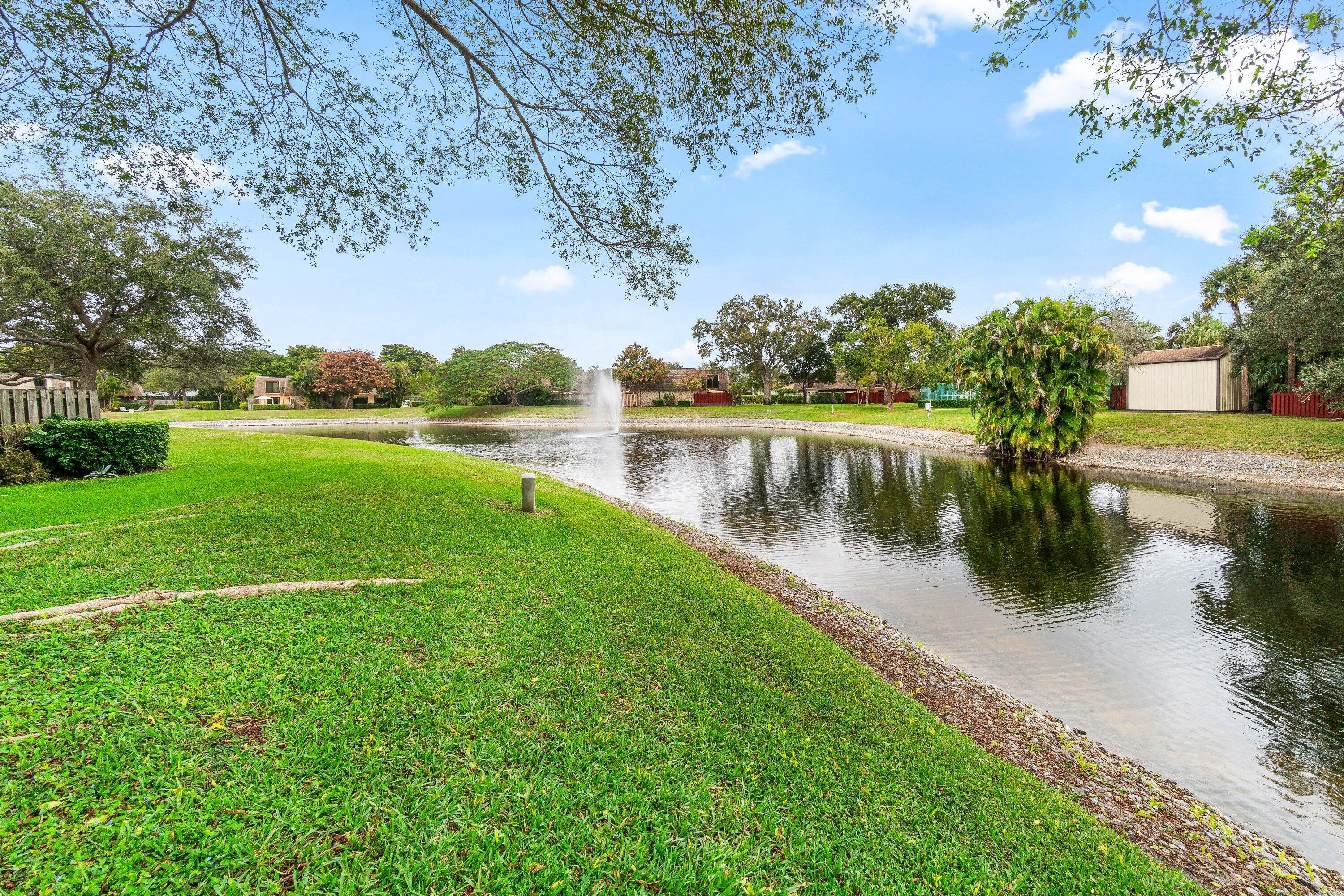 2905 Southwest 22nd Circle, Unit 40A Delray Beach, FL 33445 - Photo 30 of 38 a view of lake with green space