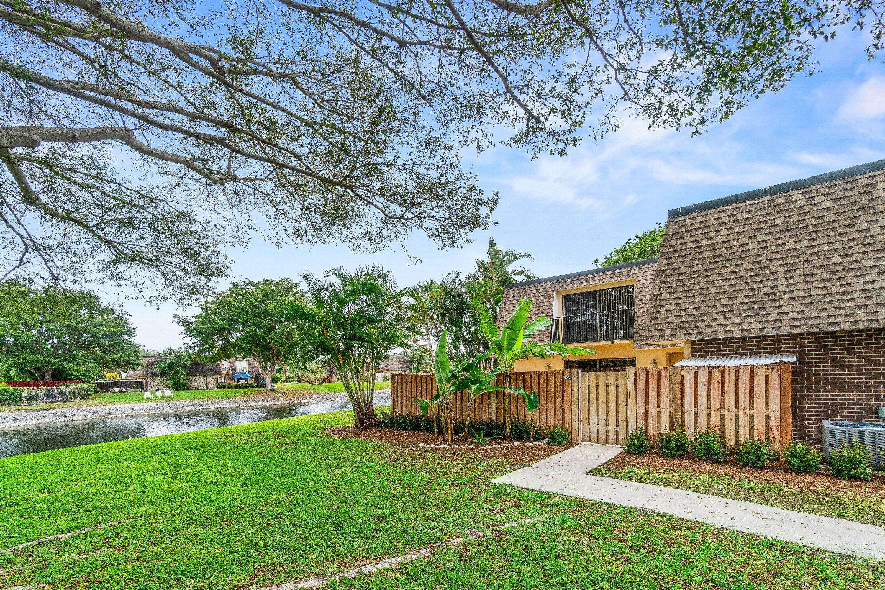 2905 Southwest 22nd Circle, Unit 40A Delray Beach, FL 33445 - Photo 31 of 38 a view of a house with a yard