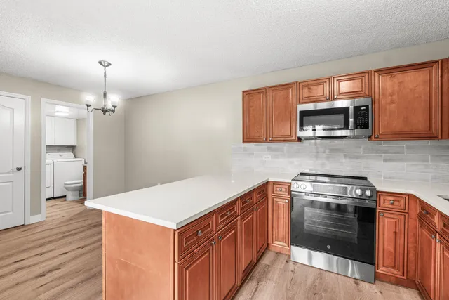 a kitchen with a stove and a microwave