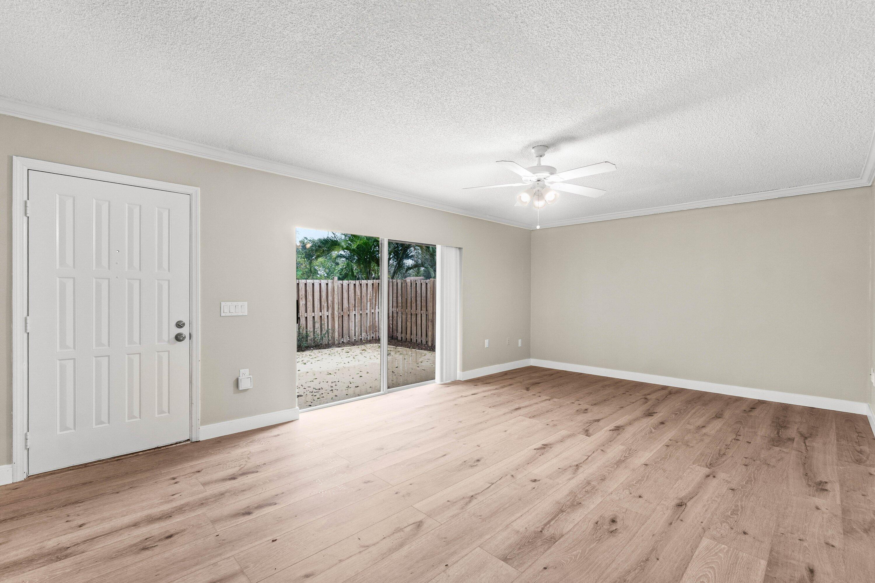 2905 Southwest 22nd Circle, Unit 40A Delray Beach, FL 33445 - Photo 10 of 38 a view of an empty room with wooden floor