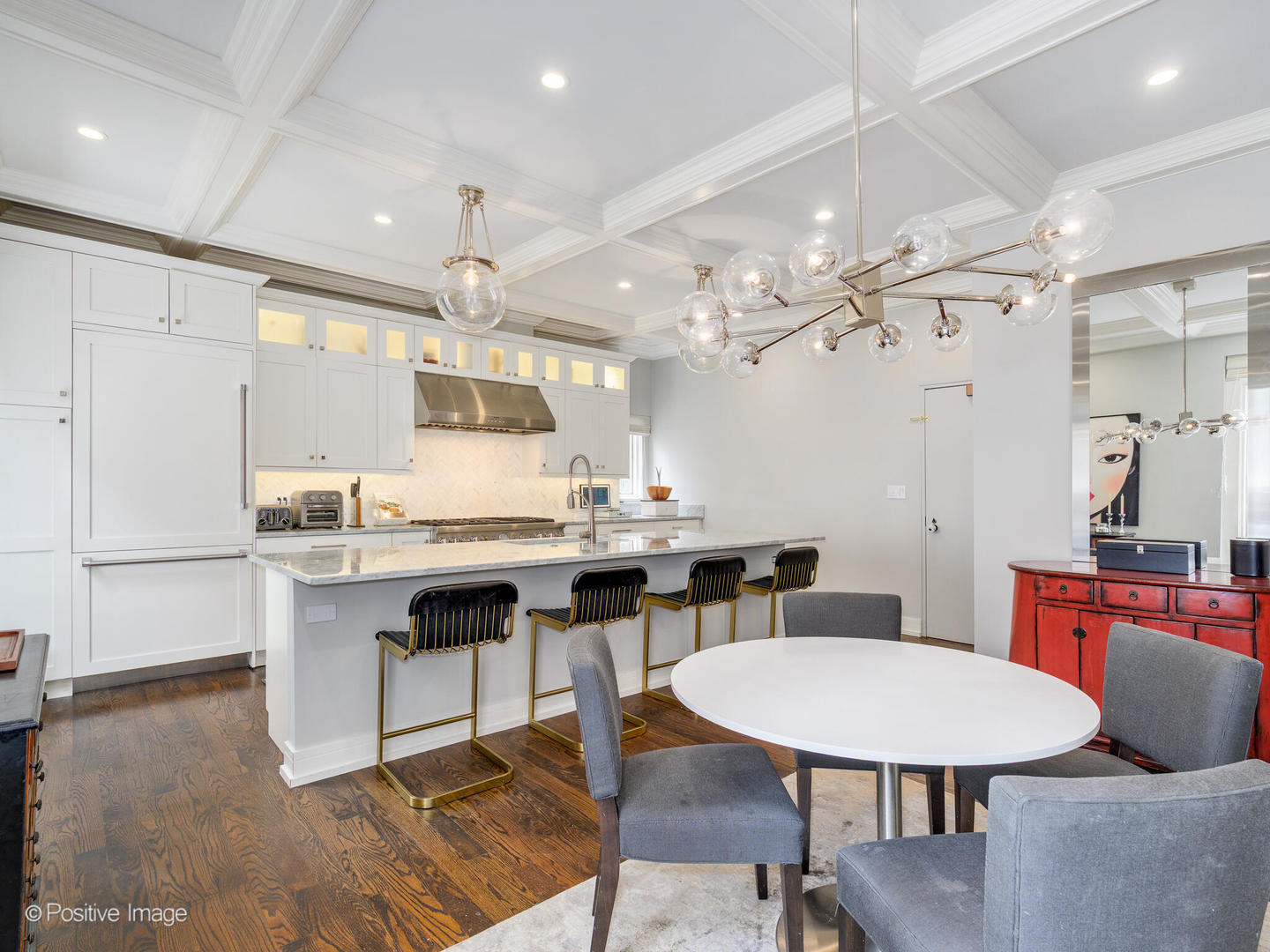 839 North Dearborn Street, Unit F Chicago, IL 60610 - Photo 8 of 40 a kitchen with granite countertop a table chairs stove a sink dishwasher and cabinets