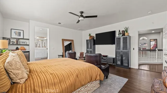 a bed room with a bed and a television