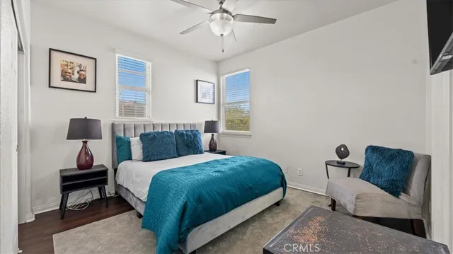 a bedroom with a bed and a couch