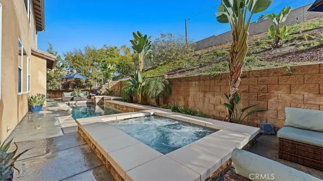 a view of a backyard with sitting area