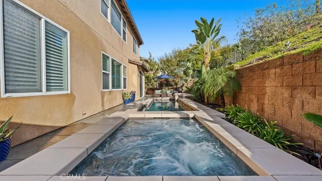 a view of a backyard with sitting area