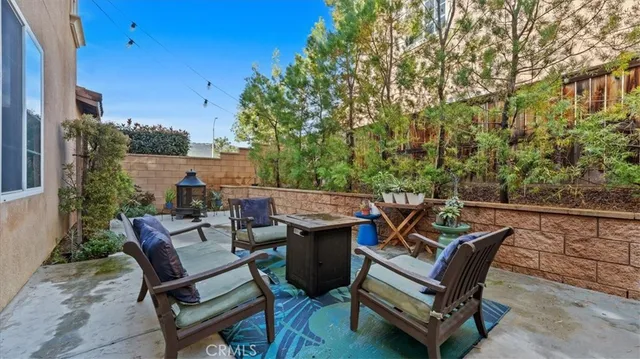 a view of a patio with a table and chairs