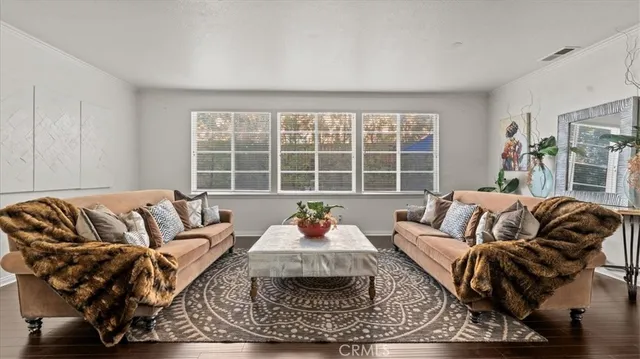 a living room with furniture window and a table