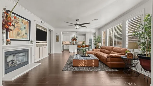 a living room with furniture flat screen tv and a fireplace
