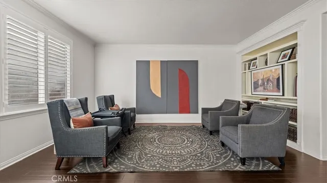 a living room with furniture and a rug