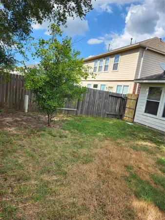 a view of a backyard with a small cabin